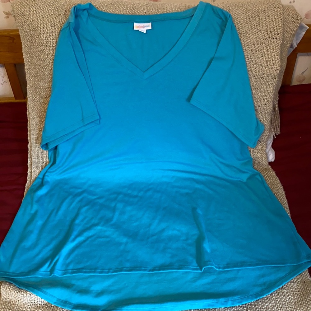 Used turquoise LLR shirt.